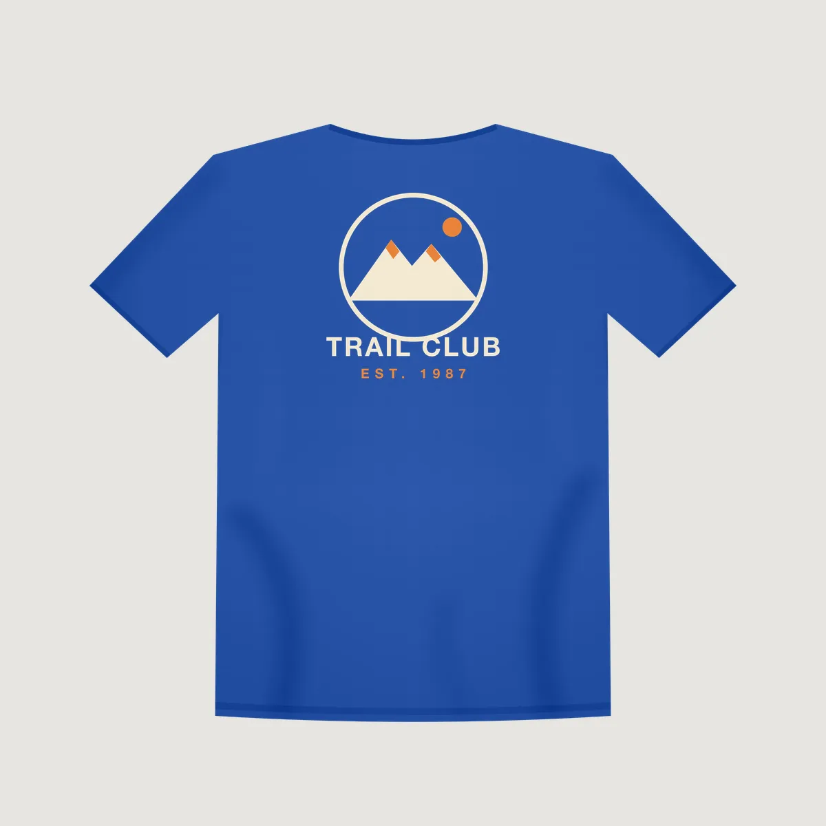 Back view of a royal blue t-shirt mockup with a large "Trail Club 1987" back print